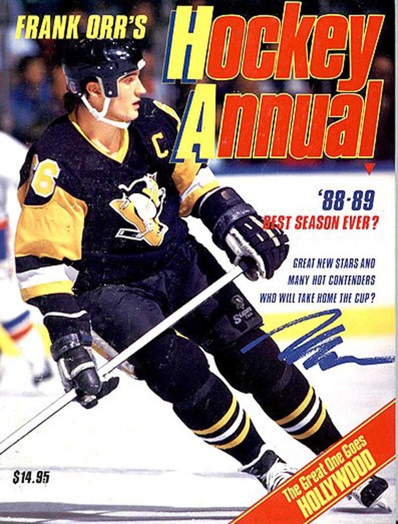 A hockey annual magazine cover with a man on the ice.